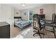 Comfortable bedroom features plush carpeting, a queen bed, computer and a window at 1140 Randall Ct, Concord, NC 28025