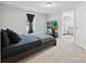 Cozy bedroom featuring plush carpet, soft lighting, and an en-suite bathroom at 1140 Randall Ct, Concord, NC 28025