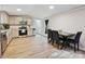 Well-lit kitchen featuring stainless steel appliances and hardwood floors at 1140 Randall Ct, Concord, NC 28025