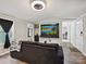 Modern living room featuring hardwood floors, a television, and comfortable seating at 1140 Randall Ct, Concord, NC 28025