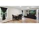 Inviting living room with hardwood floors, dining table, and large windows at 1140 Randall Ct, Concord, NC 28025