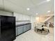 Functional kitchenette with essential appliances, ample counter space, and a dining area at 11419 Leadenhall Ln, Charlotte, NC 28262