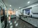 Modern kitchen with grey cabinets, stainless steel appliances, and dark hardwood flooring at 11419 Leadenhall Ln, Charlotte, NC 28262