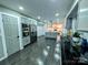 Spacious kitchen featuring modern gray cabinets, stainless steel appliances, and hardwood floors at 11419 Leadenhall Ln, Charlotte, NC 28262