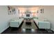 Spacious living room featuring two couches, fireplace and dark wood floors at 11419 Leadenhall Ln, Charlotte, NC 28262