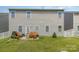 Spacious backyard with a patio, outdoor seating, grill, and a well-maintained lawn at 1220 Kent Downs Sw Ave, Concord, NC 28027