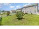 Lush green backyard with a well-kept lawn, bordered by a classic white picket fence at 1220 Kent Downs Sw Ave, Concord, NC 28027