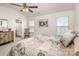 Primary bedroom featuring natural light and neutral decor throughout at 1220 Kent Downs Sw Ave, Concord, NC 28027