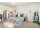 Charming bedroom with colorful accents, a decorative chandelier, and cozy furnishings at 1220 Kent Downs Sw Ave, Concord, NC 28027