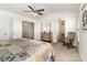 Bedroom with a ceiling fan, closet access, and neutral decor throughout at 1220 Kent Downs Sw Ave, Concord, NC 28027