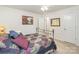 Comfortable bedroom with metal bed frame, decorative pillows, and ample natural light at 1220 Kent Downs Sw Ave, Concord, NC 28027