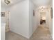 Upstairs hallway with carpet and two hanging light fixtures at 1220 Kent Downs Sw Ave, Concord, NC 28027