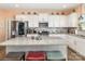 Bright kitchen features stainless steel appliances, granite countertops and a large kitchen island with seating at 1220 Kent Downs Sw Ave, Concord, NC 28027