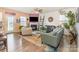 Inviting living room with stylish sofas, a fireplace, and large windows for ample natural light at 1220 Kent Downs Sw Ave, Concord, NC 28027