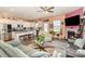 Open-concept living room with a modern kitchen, fireplace, and comfortable seating area at 1220 Kent Downs Sw Ave, Concord, NC 28027