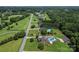 Aerial view of homes in a suburban neighborhood featuring pools and greenery at 1236 James Farm Rd, Hickory, NC 28602