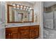 Bathroom with double vanity, floral wallpaper and large mirror at 1236 James Farm Rd, Hickory, NC 28602