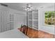 Bright bedroom with hardwood floors, built-in bookshelves and good natural light at 1236 James Farm Rd, Hickory, NC 28602