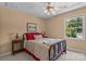 Cozy bedroom with warm paint, a metal bed frame, and a bright window at 1236 James Farm Rd, Hickory, NC 28602