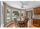 Bright dining nook with hardwood floors, large windows offering a view of the sparkling pool at 1236 James Farm Rd, Hickory, NC 28602