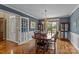 Formal dining room featuring hardwood floors and natural light through a large window at 1236 James Farm Rd, Hickory, NC 28602