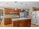 Gourmet kitchen featuring granite countertops, custom cabinetry, and stainless steel appliances at 1236 James Farm Rd, Hickory, NC 28602
