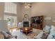 Spacious living room with fireplace, tall ceilings, and french doors to outdoor area at 1236 James Farm Rd, Hickory, NC 28602
