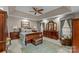 Main bedroom featuring a tray ceiling, sitting area, and beautiful furnishings at 1236 James Farm Rd, Hickory, NC 28602