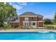 Large backyard pool with a serene view of the home and the surrounding landscaping at 1236 James Farm Rd, Hickory, NC 28602