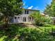 View of back exterior, including a deck, and sliding doors leading into the residence at 14307 Hartwell Farm Dr, Charlotte, NC 28278