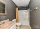 Cozy bathroom featuring a tub and shower combination with updated vanity and fixtures at 14307 Hartwell Farm Dr, Charlotte, NC 28278