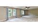 Large bedroom with carpet flooring, multiple windows and a ceiling fan at 14307 Hartwell Farm Dr, Charlotte, NC 28278