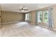 Expansive bedroom with multiple windows, carpet floors, neutral walls, and a ceiling fan at 14307 Hartwell Farm Dr, Charlotte, NC 28278