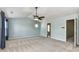 Spacious bedroom featuring neutral carpet, ceiling fan, and a decorative hanging light at 14307 Hartwell Farm Dr, Charlotte, NC 28278