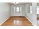 Inviting foyer with a stylish front door and gleaming hardwood floors at 14307 Hartwell Farm Dr, Charlotte, NC 28278
