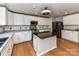 Modern kitchen featuring an island, stainless steel appliances, and plenty of cabinet space at 14307 Hartwell Farm Dr, Charlotte, NC 28278