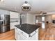 Bright kitchen with an island, stainless steel appliances, and bamboo floors at 14307 Hartwell Farm Dr, Charlotte, NC 28278