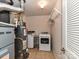 Laundry room with washer, dryer, and shelving at 14307 Hartwell Farm Dr, Charlotte, NC 28278