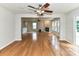 Open-concept living area with fireplace and large windows, enhanced by bamboo flooring and natural light at 14307 Hartwell Farm Dr, Charlotte, NC 28278