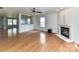 Bright living room featuring a fireplace, bamboo floors, and ample natural light at 14307 Hartwell Farm Dr, Charlotte, NC 28278