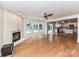 Open living space with a fireplace, hardwood floors, and easy access to the kitchen at 14307 Hartwell Farm Dr, Charlotte, NC 28278