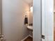 Cozy powder room featuring a sink and towel rack at 14307 Hartwell Farm Dr, Charlotte, NC 28278