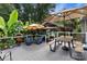 Staged back deck with an umbrella-covered picnic table, seating, and outdoor living at 1507 Breckenwood Dr, Rock Hill, SC 29732