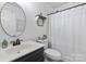 Bright and clean bathroom features stylish fixtures, a modern vanity, and a shower with a decorative curtain at 1507 Breckenwood Dr, Rock Hill, SC 29732