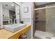 Modern bathroom features a sleek vanity with a vessel sink and a tiled glass-enclosed shower with a rainfall showerhead at 1507 Breckenwood Dr, Rock Hill, SC 29732