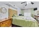 Comfortable bedroom showcasing a wooden headboard, ceiling fan, and warm natural light, with neutral colored walls at 1507 Breckenwood Dr, Rock Hill, SC 29732