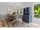 Bright dining area with classic wooden table, ample windows, and view into the kitchen at 1507 Breckenwood Dr, Rock Hill, SC 29732
