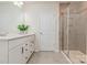 Bathroom with a double vanity, white cabinetry, a toilet, and a shower behind glass doors at 1514 Starmount Cove Ln, Charlotte, NC 28210