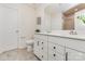 Bathroom with a double vanity, white cabinetry, a toilet, and a shower behind glass doors at 1514 Starmount Cove Ln, Charlotte, NC 28210