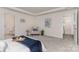 Spacious bedroom with a seating area and easy access to the bathroom and hallway at 1514 Starmount Cove Ln, Charlotte, NC 28210